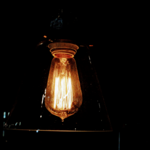 A light bulb flickering in a socket